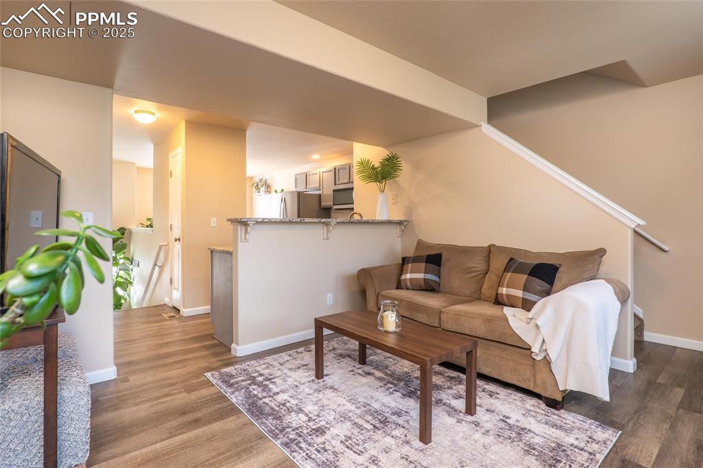 Image 9 of 25: Open concept Living Room from the kitchen.