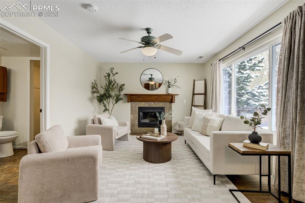 Image 17 of 46: Fireplace & big windows. Need we say more?