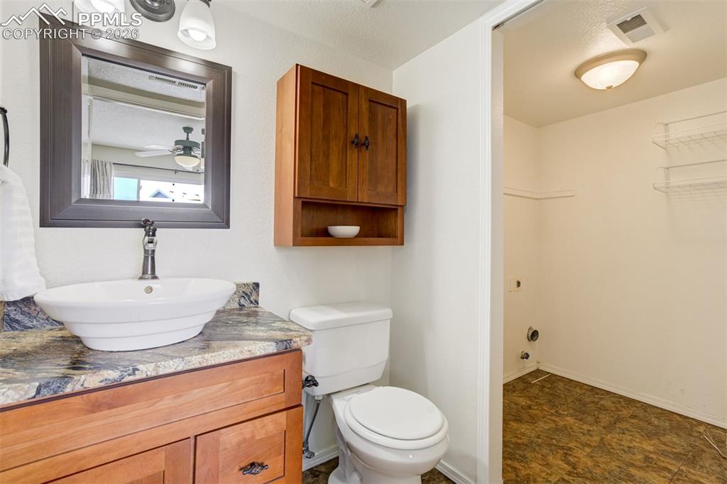 Image 20 of 46: Doors lead to the laundry area. 