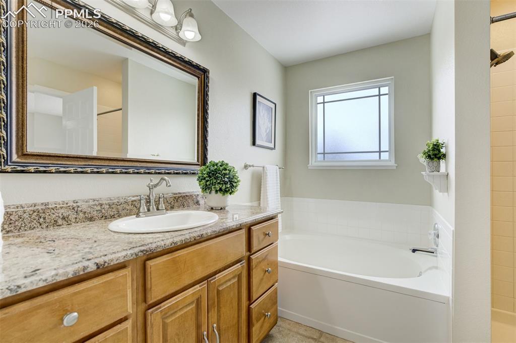 Image 24 of 46: Soaking tub & standing shower. Yes please! 