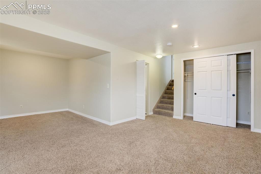 Image 32 of 46: Finished basement / 4th bedroom with a bathroom & kitchenette area. 