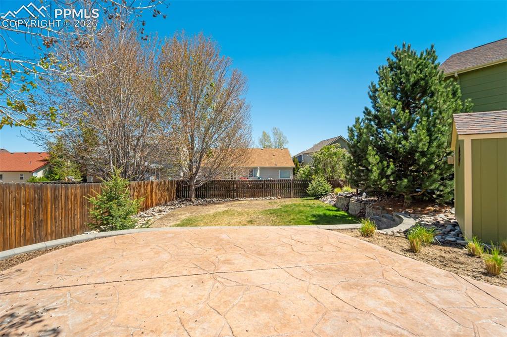 Image 40 of 46: The custom concrete for a fire pit area in the backyard.