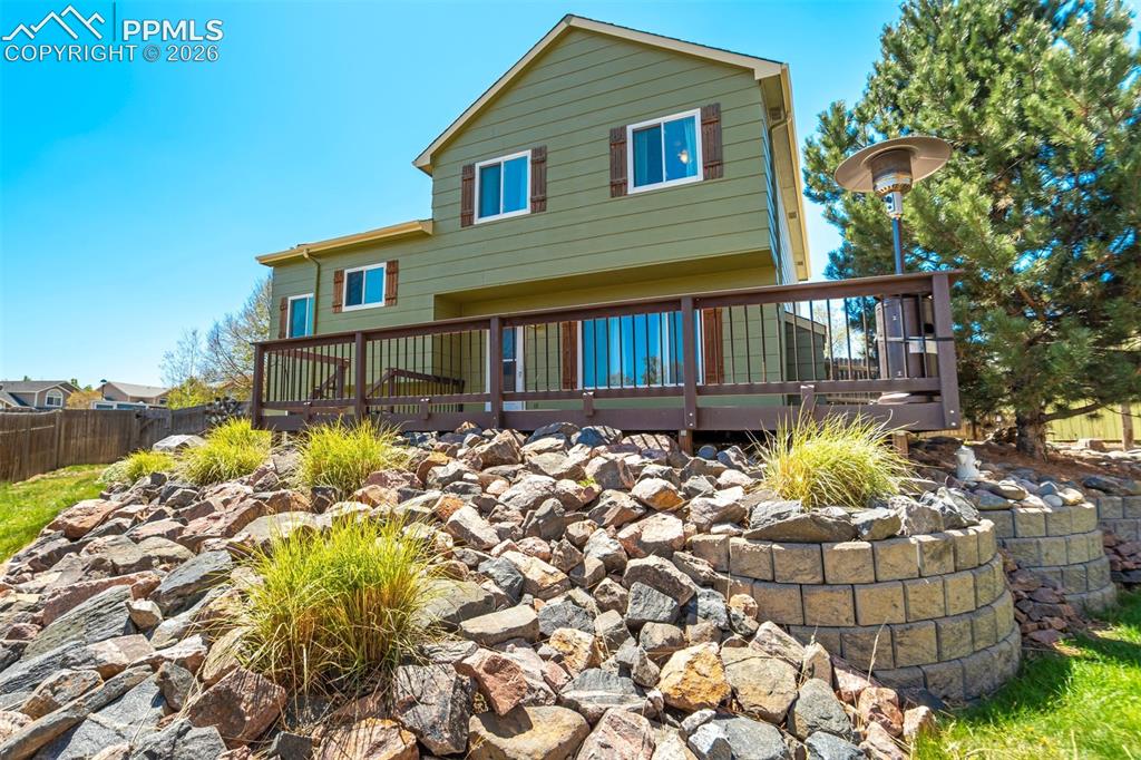 Image 43 of 46: Beautiful landscaping without sacrificing space to actually enjoy the yard.
