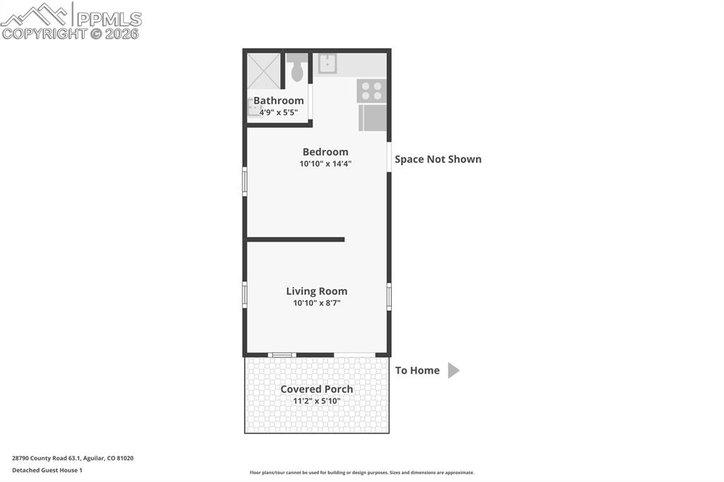 Image 11 of 50: Main "tiny" home log cabin.