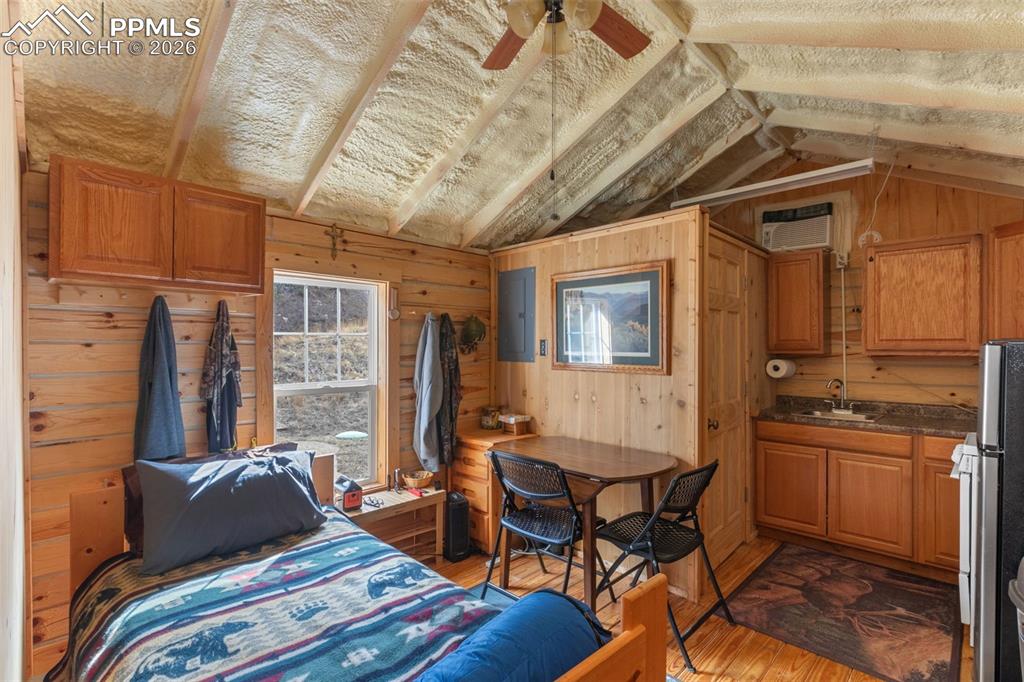 Image 15 of 50: Main cabin sleeping, dining, kitchen area.