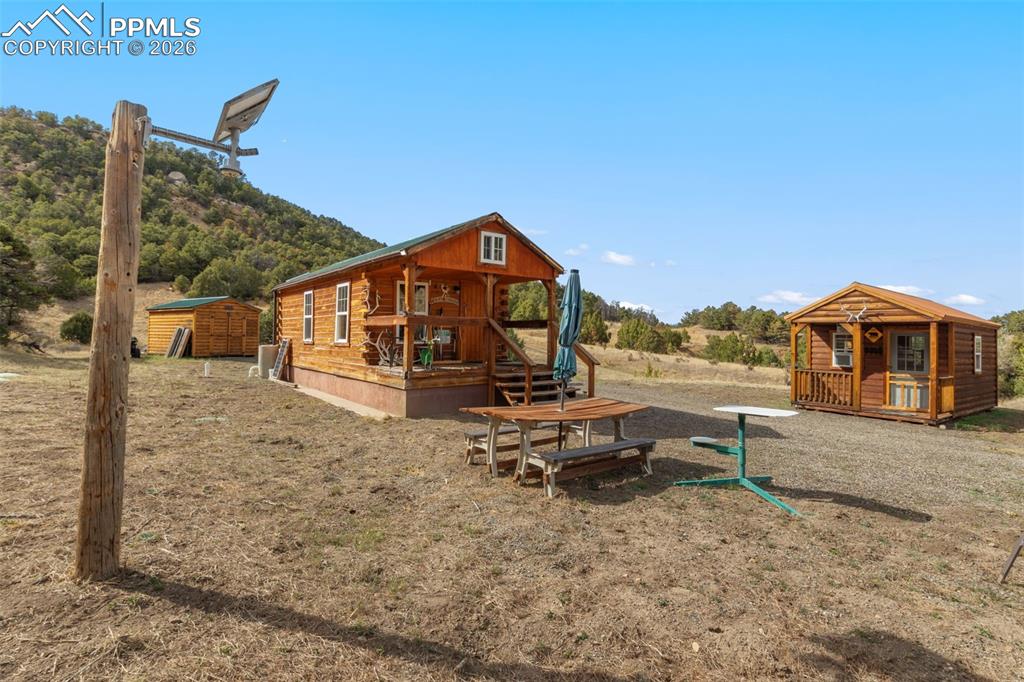 Image 19 of 50: Front of main cabin and bunkhouse cabin.