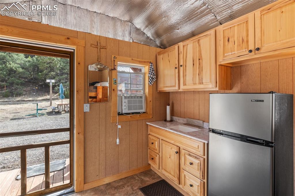 Image 26 of 50: Bunkhouse cabin kitchen area.