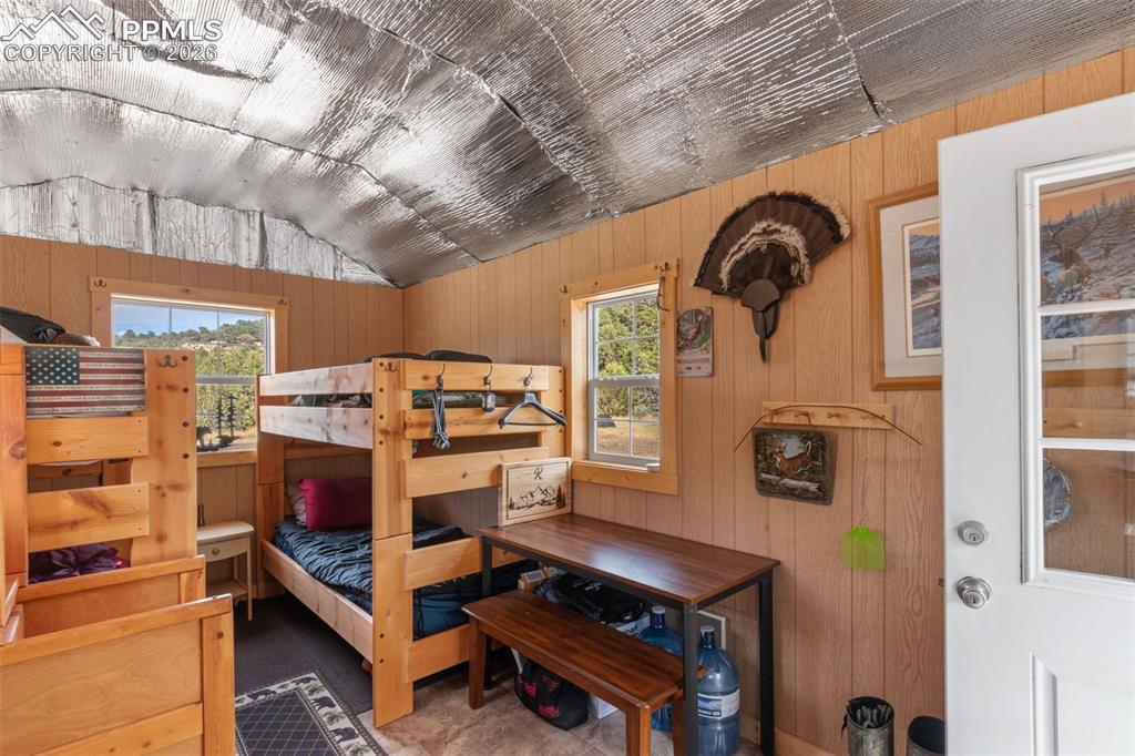 Image 28 of 50: Bunkhouse cabin sleeping area.