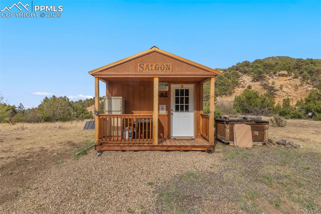 Image 34 of 50: Front of bunkhouse cabin.