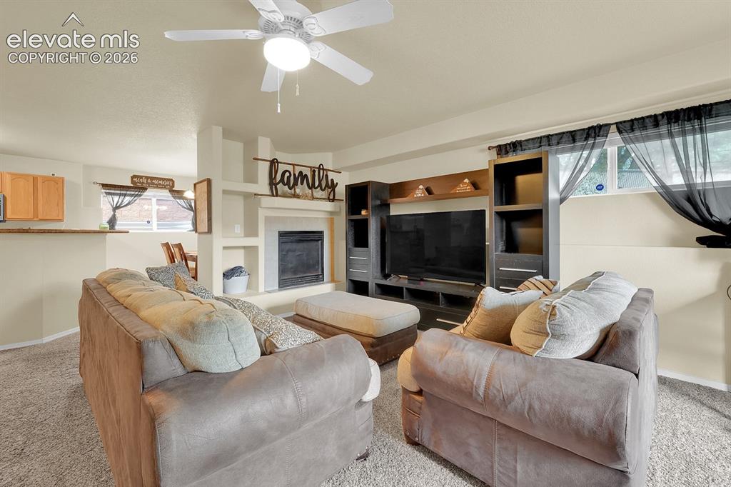Image 3 of 17: Open-concept living space to kitchen and dining room. 