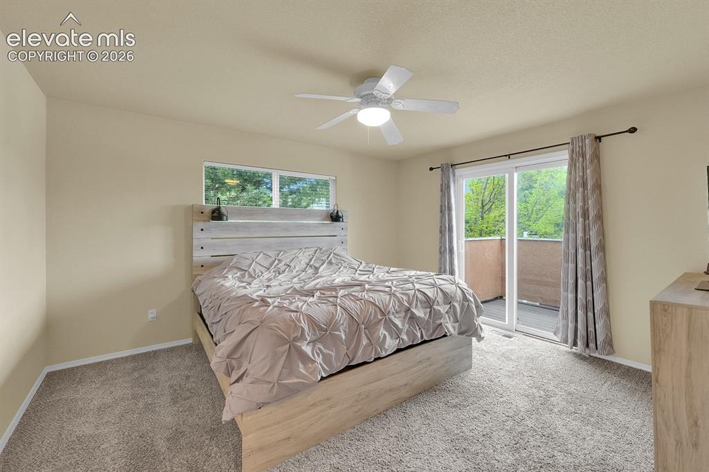 Image 4 of 17: Primary bedroom with walk-out balcony. 