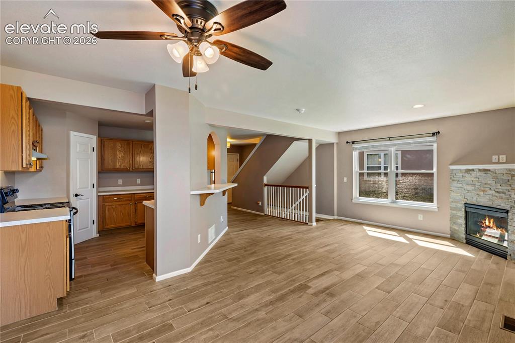 Image 27 of 48: Newer floors, open floor plan, recessed lighting.