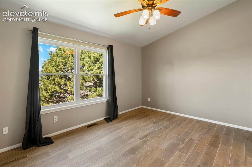 Image 29 of 48: Bedroom, large window.