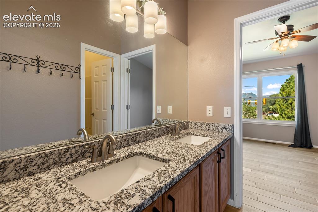 Image 33 of 48: Double vanity, natural light, new granite countertop upstairs bathroom.