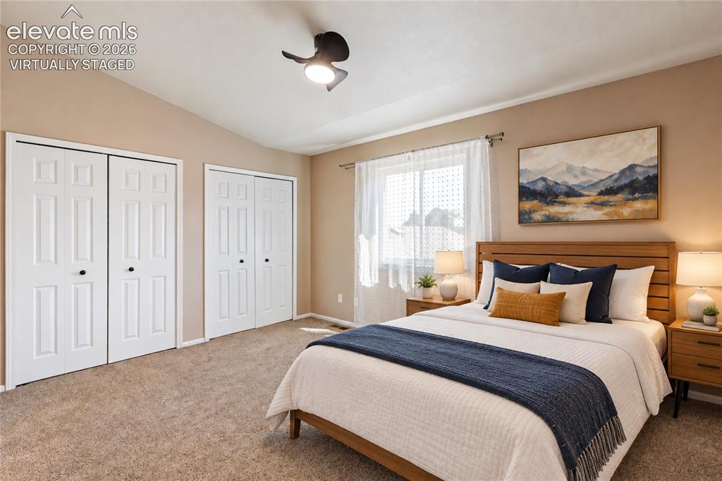 Image 9 of 48: Virtually Staged-large primary bedroom.