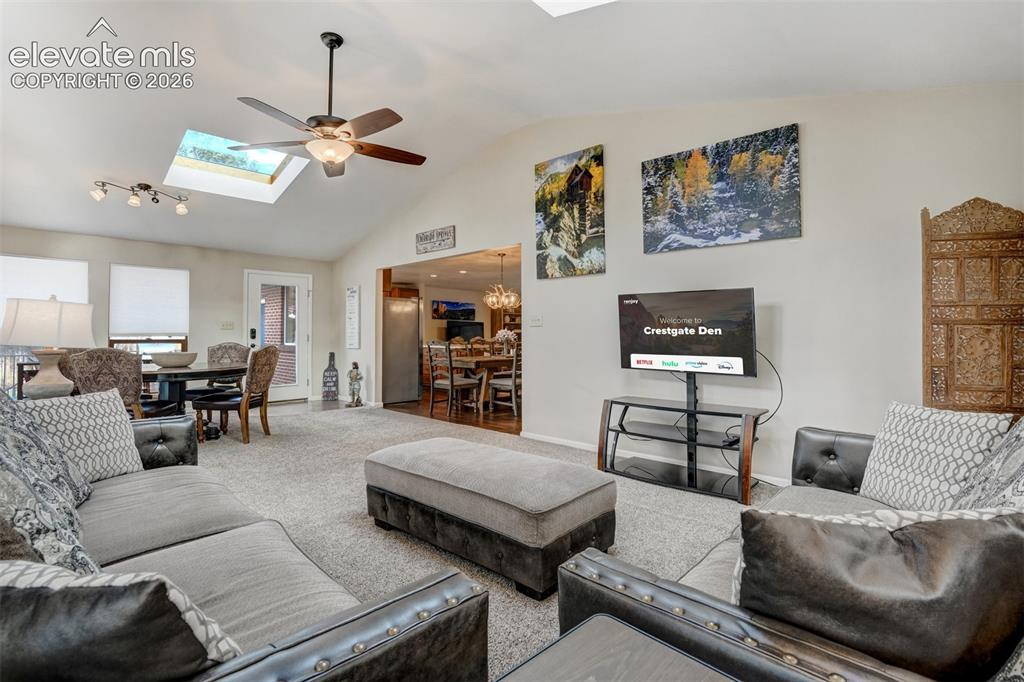 Image 20 of 50: Vaulted ceilings with skylights, recessed lighting, and an overhead ceiling