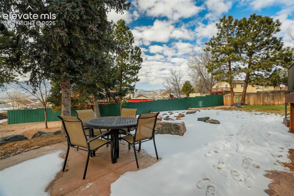 Image 44 of 50: Expansive patio area with a concrete surface