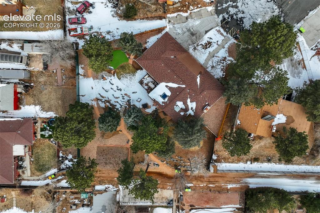 Image 49 of 50: Expansive property featuring multiple structures with shingle roofs, surrou