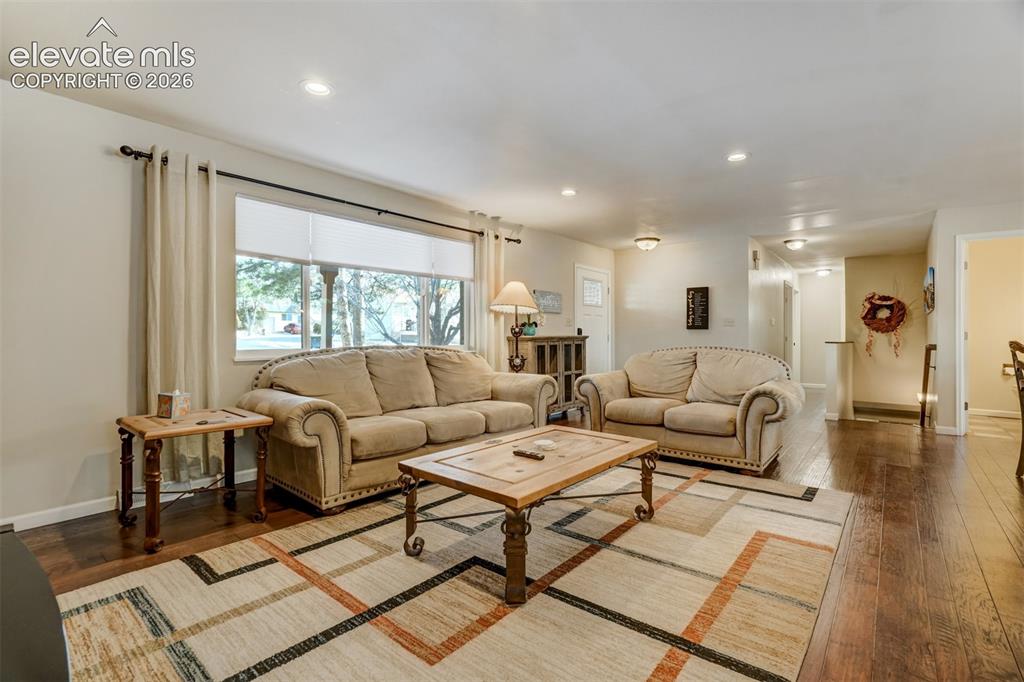 Image 7 of 50: Hardwood-finish flooring throughout, recessed ceiling lighting, ample natur
