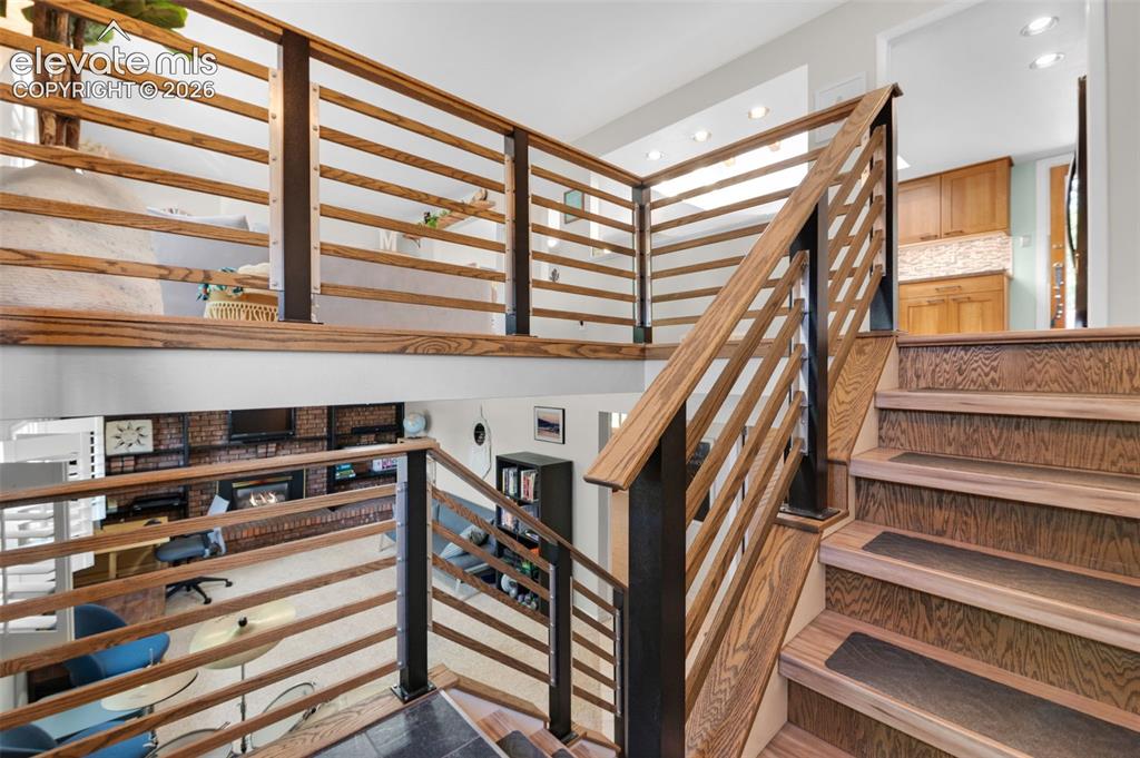 Image 4 of 44: Welcome Home!  The attractive staircase will take you either up or down