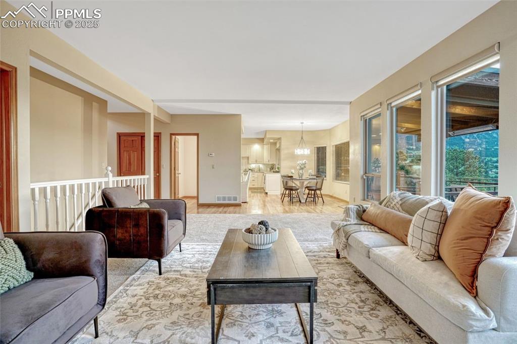 Image 13 of 43: Take it all in from the living room looking out over green space and the Fr