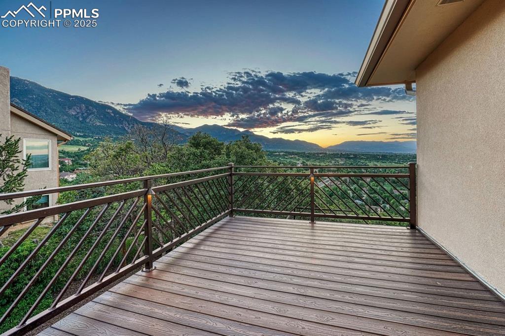 Image 21 of 43: Morning coffee or evening escape to the private deck, steps from the primar