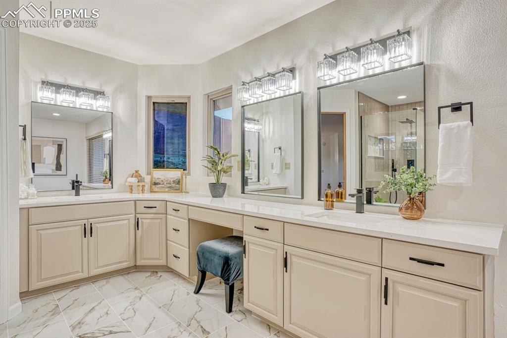 Image 24 of 43: Double sinks, extended vanity & abundant storage so there
