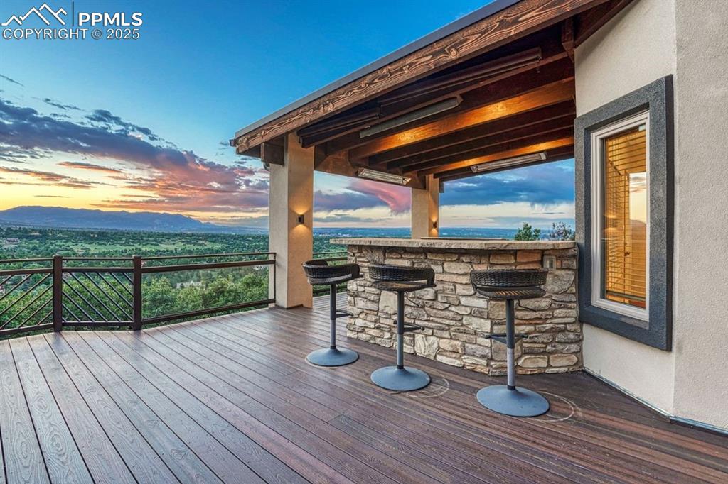Image 38 of 43: Outdoor grilling station with bar - and a view!