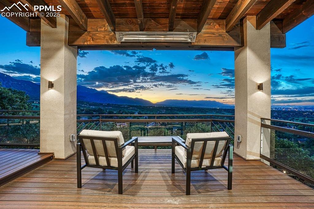 Image 40 of 43: Covered & heated deck extends the living space and seasonal use