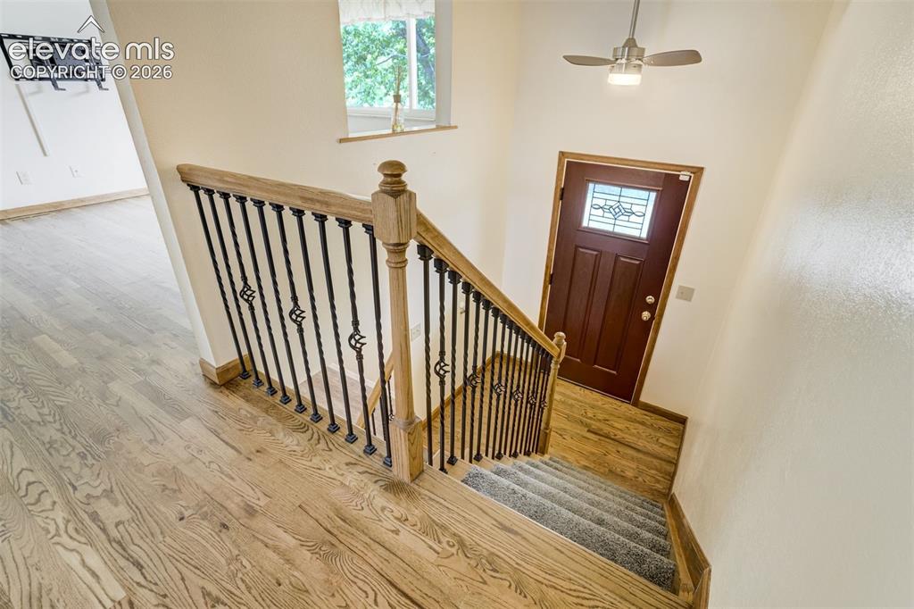 Image 10 of 50: Natural Oak Wood Floors at the Entry, Nice Staircase, So Pretty!