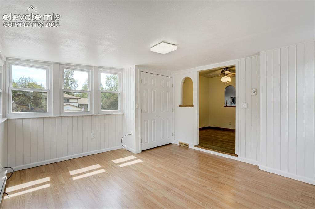 Image 19 of 50: Sun Room with lots of windows for sunlight and warmth!