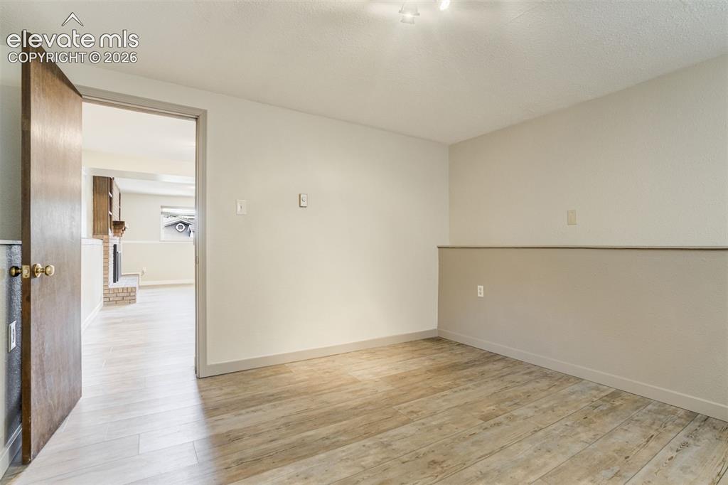 Image 26 of 50: Office? Exercise Room? Guest nonconforming Bedroom? Your Choice!