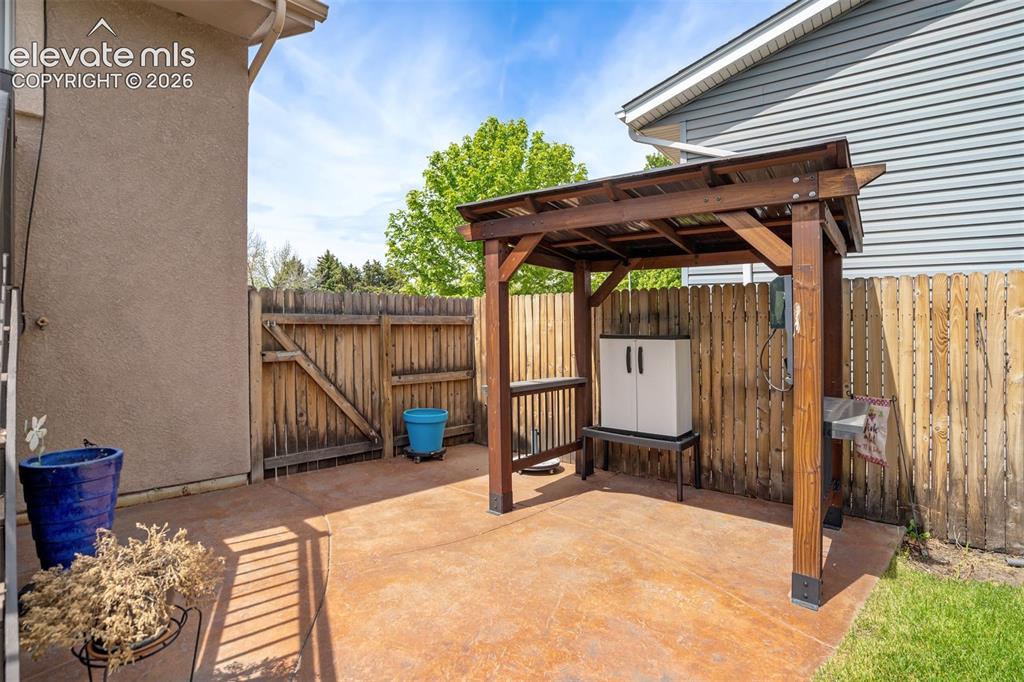 Image 39 of 50: Stamped Concrete Patio and Pergola is staying! Extra bonus!