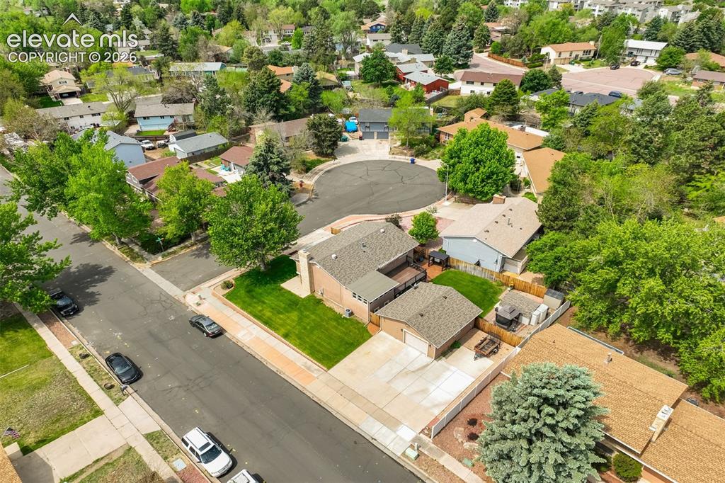 Image 47 of 50: Look at that nice corner lot with all that garage space, beautiful landscap