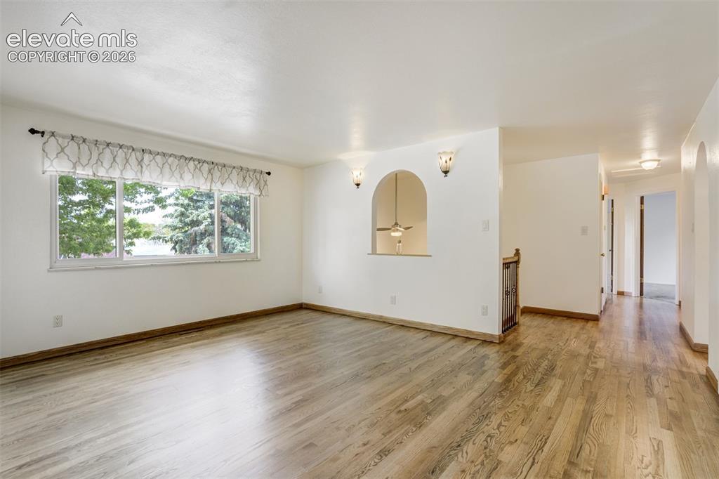 Image 8 of 50: Living Room Flows to the bedrooms with the Natural Oak Wood Floors up to th