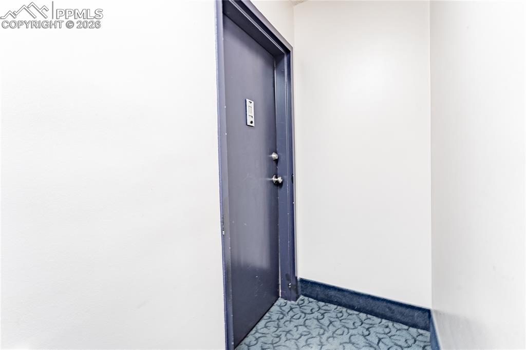 Image 17 of 19: Front door of the home.