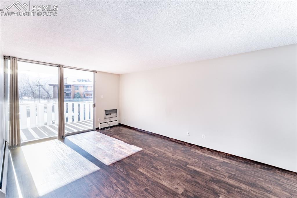 Image 2 of 19: Enjoy the living area with its gorgeous mountain views and natural lighting