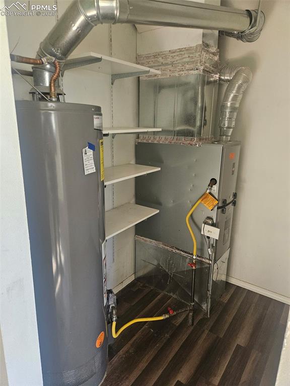 Image 12 of 20: Mechanical room with pantry shelving