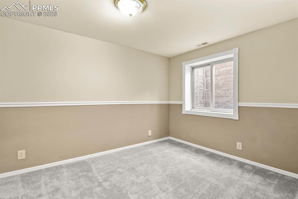 Image 35 of 43: Basement Bedroom
