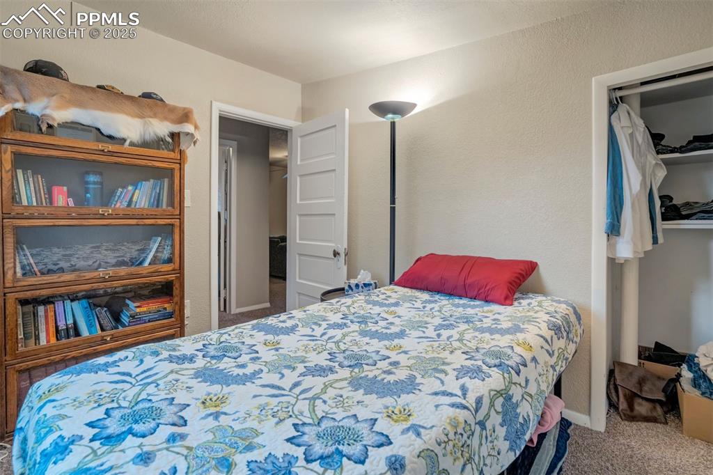 Image 14 of 24: Bedroom with carpet floors