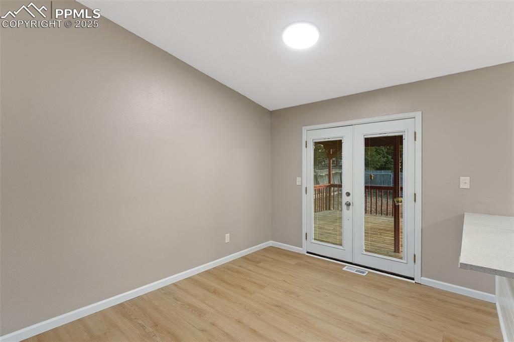 Image 11 of 26: French doors off dining area 