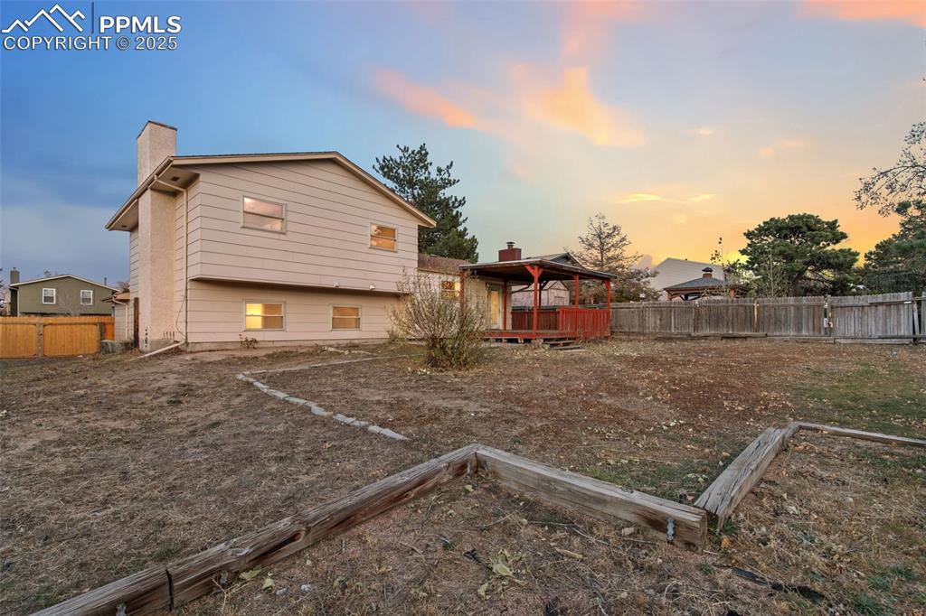 Image 24 of 26: Fully fenced backyard