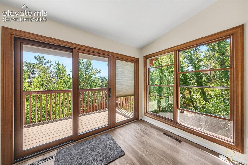 Image 10 of 42: Pella double hung wood-clad windows with integrated blinds