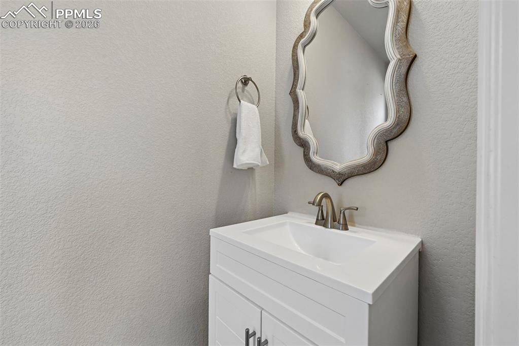 Image 5 of 38: main level half bath