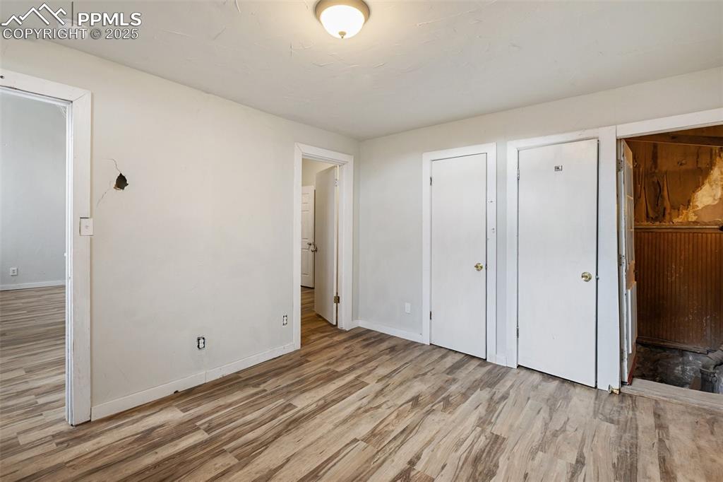 Image 14 of 34: Bedroom with new laminate flooring