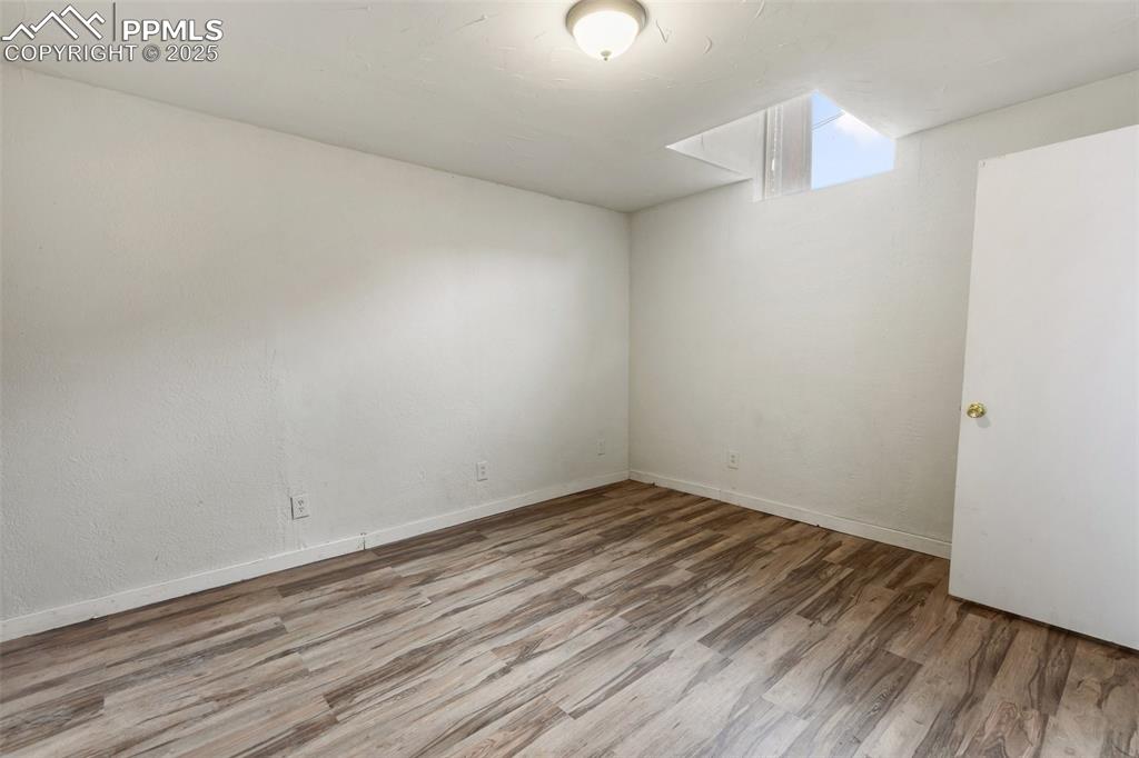 Image 15 of 34: Bedroom with new laminate flooring