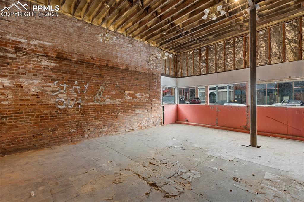 Image 5 of 34: Historic commercial space offering a blank canvas for retail, gallery, or c