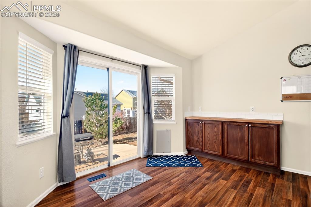 Image 12 of 36: Walk out from kitchen to back patio