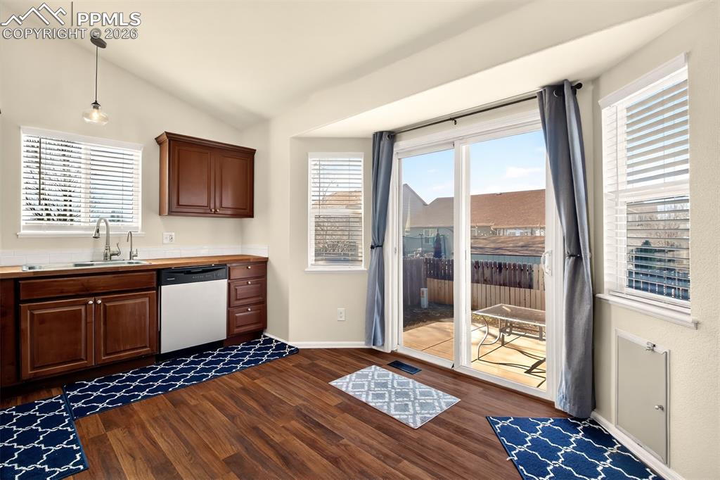 Image 13 of 36: Walk out from kitchen to back patio