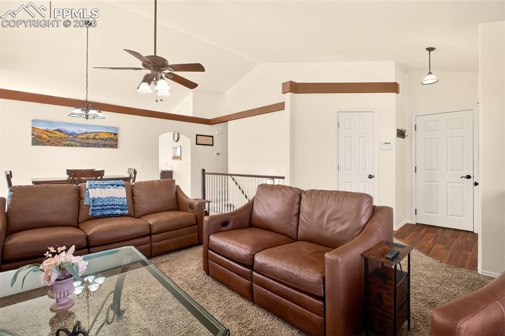 Image 4 of 36: Open concept living room and dining room with gas fireplace